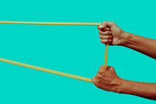 man stretches a resistance band