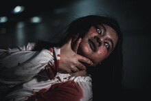 Horror Bloodthirsty Woman Ghost Or Zombie She Is Horror Scary With Breaks Her Neck At Dark Night, Screaming Zombie Female Face With Blood, Happy Halloween Day Festival Concept