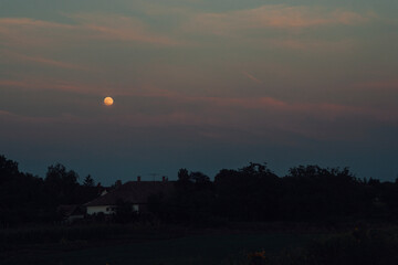 Moonrise over village
