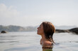© Alba Vitta/Stocksy - Portrait of Woman swimming in the sea