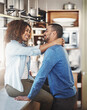 © Lyndon Stratford/peopleimages.com - Happy loving young couple having a romantic morning in the kitchen at home. Man and woman smiling in love and happiness and spending affectionate free time together in their kitchen