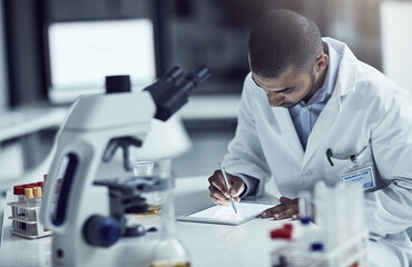 Poster - Scientist, researcher and medical technician writing on a tablet, recording information and results in a lab. Focused and serious worker using technology for innovation and research in a laboratory