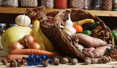 Wall Mural - Baskets of Fresh Vegetables and Bread in Rustic Kitchen With Jars of Dried Food in Background