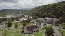Pull Away Reveal Of St Mary Parish Church In Port Maria, Jamaica To Show The Town From Above