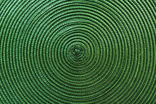 Texture Of Green Plastic Woven Placemat On Dining Table
