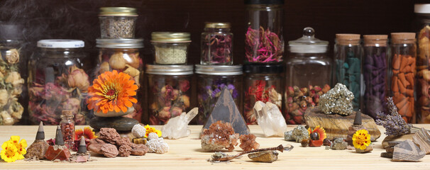 Meditation Altar With Rock Crystals and Flowers. Jars of Herbs in Background