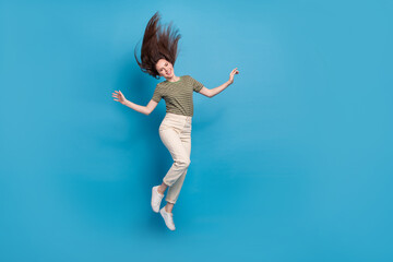 Poster - Full body photo of cool millennial brunette lady jump wear casual cloth isolated on blue background