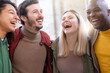© Armando Oliveira - Multiracial group of friends having fun together outside - Millenial people laughing hugging at party - Friendship concept with guys and girls outside