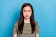 Leinwandbild Motiv Photo of cute millennial brunette lady hold air wear green t-shirt isolated on blue color background