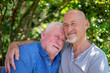 © Cultura Creative - Senior male couple relaxing in garden