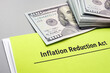 Leinwandbild Motiv The Inflation Reduction Act of 2022 and cash on it.