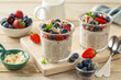 Overnight oats with fresh berries in glass jar, healthy breakfast