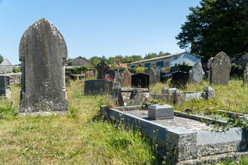 Wall Mural - old stone cross in the cemetery