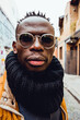 © Cavan Images - close up vertical portrait of serious african man outdoors