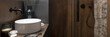 Trendy bathroom with small white washbasin, panorama