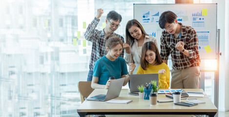 Canvas Print - Brainstorming Collaboration and  successful partnership analysis by Young business Asian people working in an office workspace