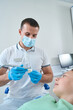 Professional pediatric dentist conducting restorative dentistry procedure