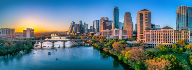 Austin, Texas- Panoramic cityscape and Colorado River against the sunset sky