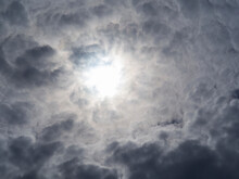 Dark Cumulus Clouds And Pale Sun, Textured Cloud Background