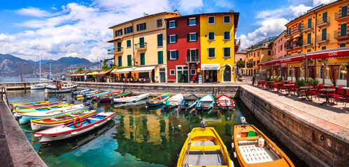 Wall Mural - Scenic Lake Lago di Garda, Italy, Charming fishing village with colorful houses and boats - Castelletto di Brenzone. 28/07/2022