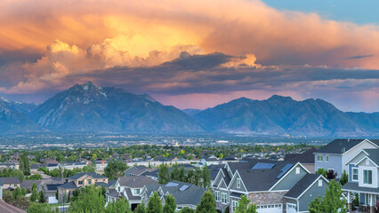 Wall Mural - Panorama Dramatic sunset with clouds Panoramic view of Salt Lake City residential area in Utah