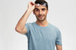 © SHOTPRIME STUDIO - Cheerful man in blue t-shirt glasses for vision smile emotions light background