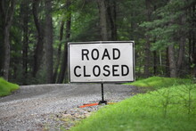 Road Closed Sign On Rural Gravel Road