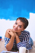 © lenets_tan - Portrait of female painter sitting on floor after painting