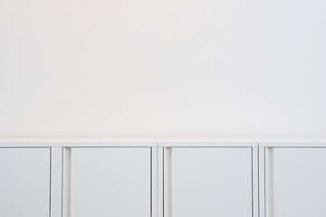 Wall Mural - Modern white cabinet on a white background.