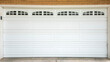 Panorama White sectional garage door with window panels and concrete driveway