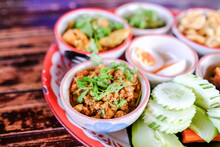 Northern Traditional Thai Food Set Called "Kantoke Dinner" Consist Of Crispy Pork,tomato Paste, Mix Vegetable,mince Pork, Chilli Paste, Sausage