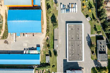 Wall Mural - suburb industrial area. distribution warehouses and industrial buildings, view from above.