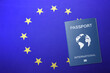 Leinwandbild Motiv International passport on flag of European Union, top view