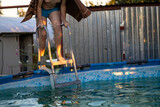 Fototapeta Fototapety do łazienki - boy with a towel enters the pool