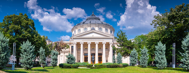 Travel to Romania. Amazing view of the Romanian Atheneum landmark from Bucharest in a beautiful summer sunny day with blue sky.