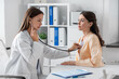 © Syda Productions - medicine, healthcare and people concept - female doctor with stethoscope and woman patient at hospital