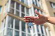 © RomanR - home owner man or realtor or buyer showing bunch of keys to apartment or rental house.