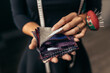 © Jacob Lund - Female tailor holding fabric swatches