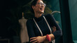 © Jacob Lund - Female fashion designer laughing in her studio