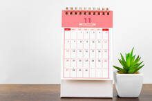 November 2022 Desk Calendar On Wooden Background.