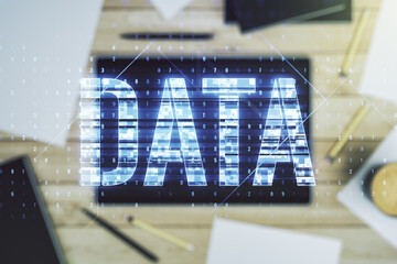 Wall Mural - creative data word sign and modern digital tablet on background, top view. multiexposure
