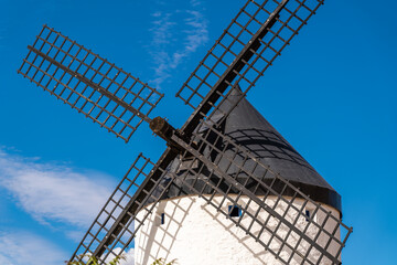 Wall Mural - Beautiful wind mill isolated in top of a hill near to Consuegra city in Castilla-La Mancha - Spain. Cloudy day.