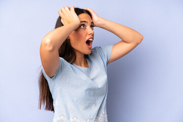 Wall Mural - hispanic pretty woman with open mouth, looking horrified and shocked because of a terrible mistake, raising hands to head