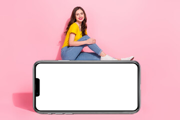 Sticker - Full body profile portrait of cheerful charming girl sitting empty space blank isolated on pink color background