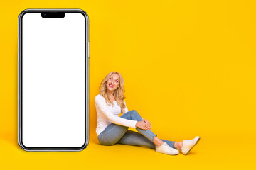 Sticker - Full size photo of nice millennial blond lady sit look promo wear shirt jeans footwear isolated on yellow background