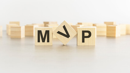 Poster - wooden cube with the letter from the mvp word. mvp - Minimum Viable Product