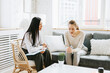 © klavdiyav - psychological consultation young Asian specialist psychologist or coach conducts a session for a patient of a young woman, problem solving, mental health