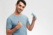 © SHOTPRIME STUDIO - portrait man in blue t-shirt glasses gesture hands smile emotions isolated background