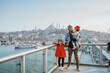 © Odua Images - father and daughter travel to turkey. portrait of dad and kid enjoying the view of beautiful istanbul turkey from the bridge