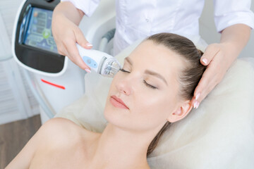gorgeous woman in beauty clinic receives non-surgical face lift. smas ultrasonic uplift. facelift. r